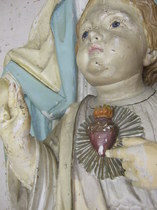 damaged wood religious statues